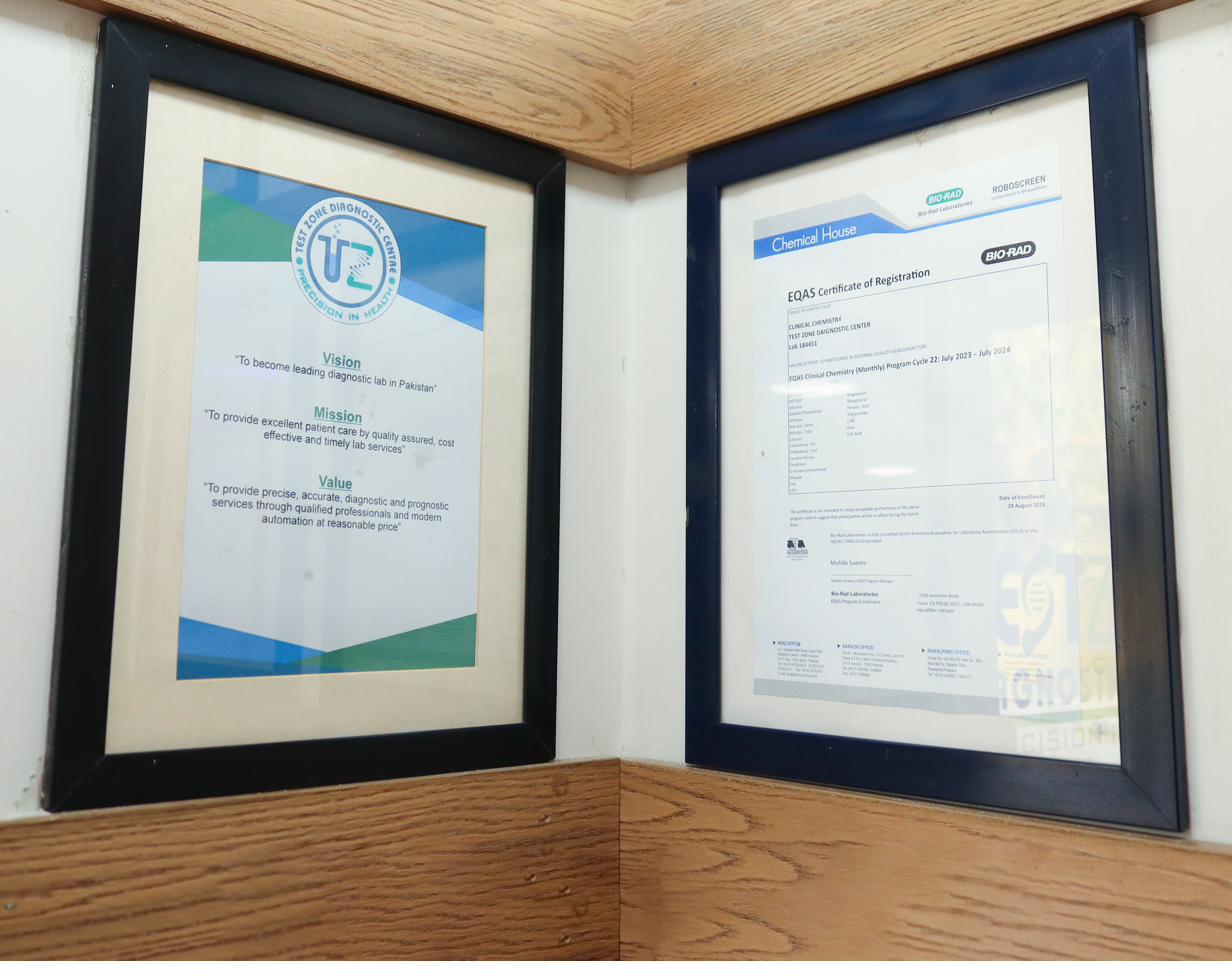 Framed accreditation and quality certificates displayed at Test Zone Diagnostic Centre
