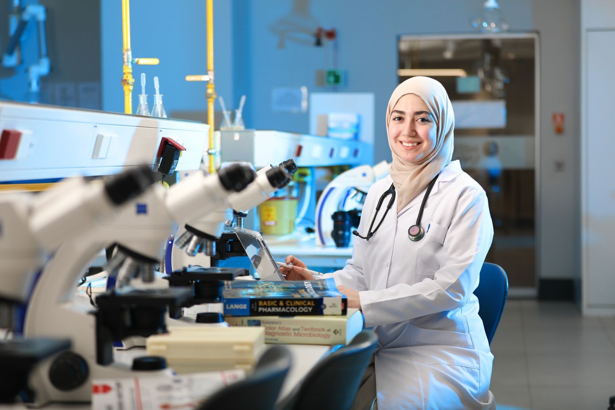 Laboratory scientist in a white coat in a modern pathology lab